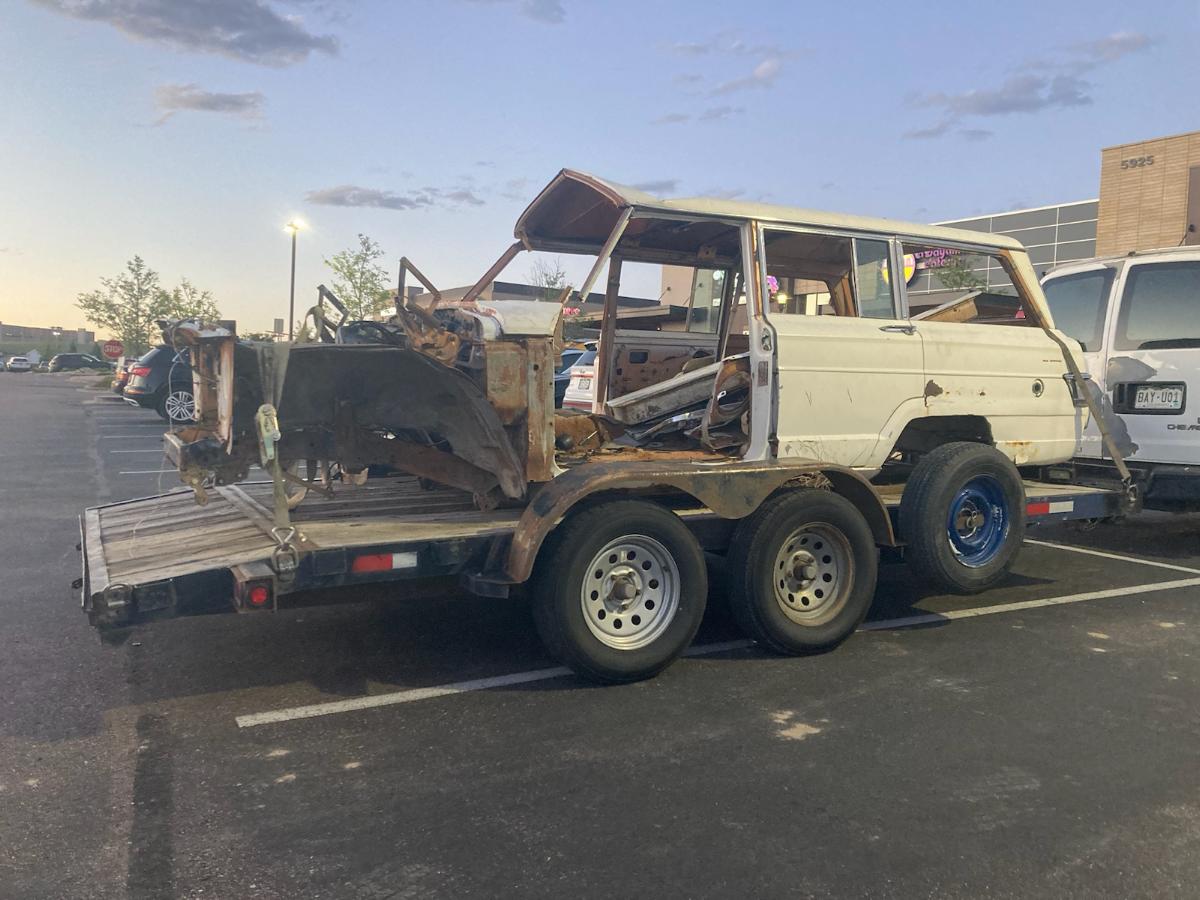 Truck moving trailer down the road